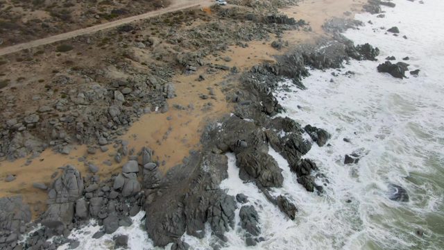 PUNTA GORDO EAST CAPE BCS MEXICO-2022: Waves Crashing on Rocky Shore with Sandy Beach