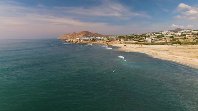 EL TULE LOS CABOS BCS MEXICO-2022: People Riding Waves in the Ocean near a Sandy Beach