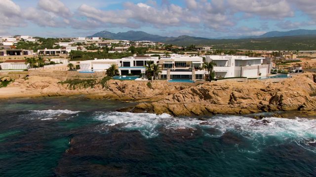 EL TULE LOS CABOS BCS MEXICO-2022: Modern Buildings on Rocky Coast with Ocean Waves