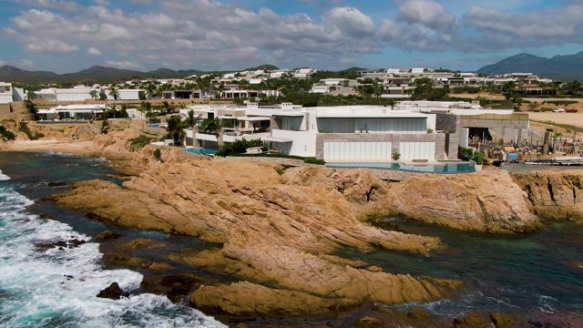 EL TULE LOS CABOS BCS MEXICO-2022: Rocky Coastline with Modern Villas and Ocean Waves