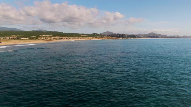 EL TULE LOS CABOS BCS MEXICO-2022: Gentle Ocean Waves Along Sandy Shoreline