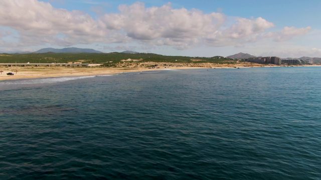 EL TULE LOS CABOS BCS MEXICO-2022: Vehicle Moving Along Sandy Beach and Ocean