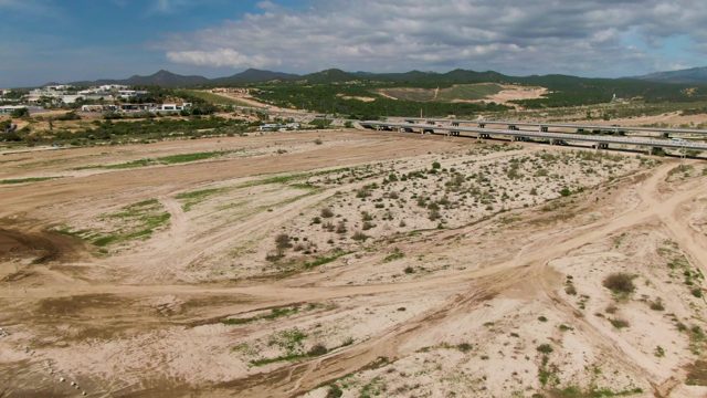 EL TULE LOS CABOS BCS MEXICO-2022: Car Crossing Bridge over Arid Terrain