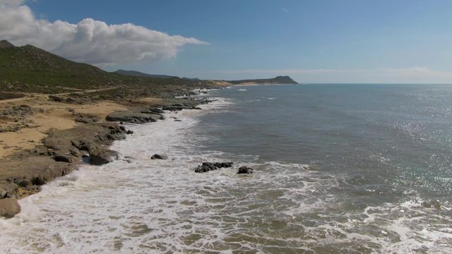 BUZZARDS EAST CAPE LOS CABOS BCS MEXICO-2022: Ocean Waves Crashing on Rocky Coastline