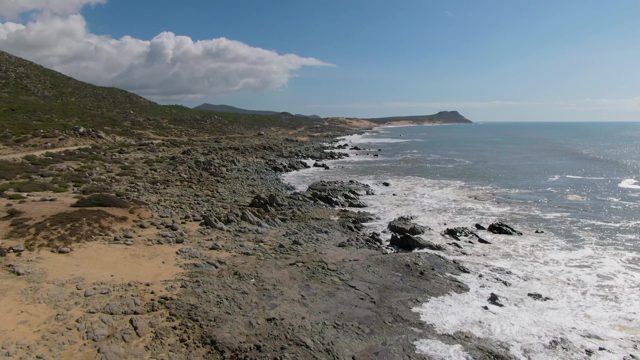 BUZZARDS EAST CAPE LOS CABOS BCS MEXICO-2022: Rocky Coastline with Waves Crashing on Shore