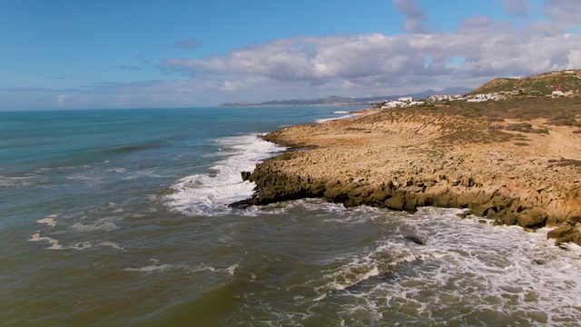 BUZZARDS EAST CAPE LOS CABOS BCS MEXICO-2022: Waves Crashing Against Rocky Coastline