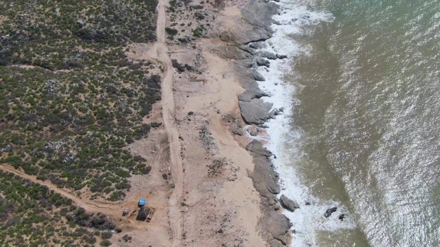 BUZZARDS EAST CAPE LOS CABOS BCS MEXICO-2022: Dirt Road Along Rocky Coast with Ocean Waves