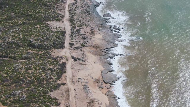 BUZZARDS EAST CAPE LOS CABOS BCS MEXICO-2022: Dirt Road Parallel to Rocky Ocean Coast
