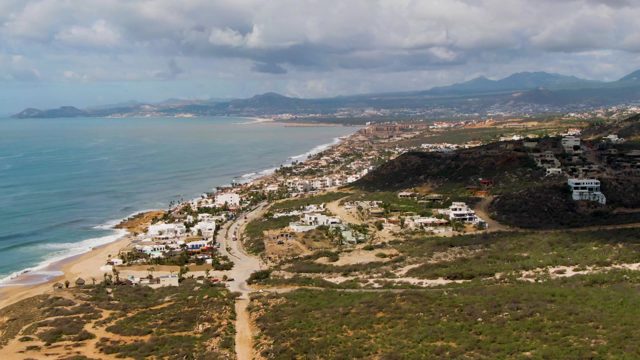BUZZARDS EAST CAPE LOS CABOS BCS MEXICO-2022: Coastal Scene with Moving Clouds and Ocean Waves