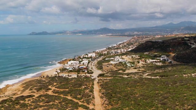 BUZZARDS EAST CAPE LOS CABOS BCS MEXICO-2022: Coastal Scene with Shifting Clouds and Ocean Waves