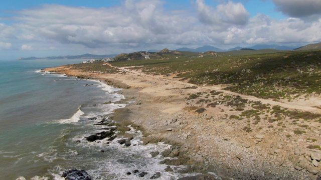 BUZZARDS EAST CAPE LOS CABOS BCS MEXICO-2022: Coastal Waves Crashing on Rocky and Sandy Shore