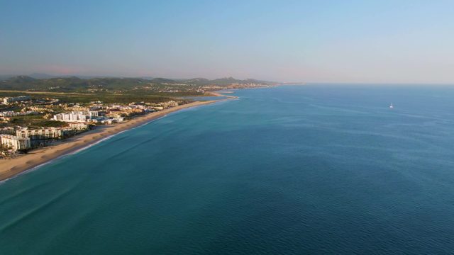 SAN JOSE DEL CABO BCS MEXICO-2022: Gentle Ocean Waves Along Sandy Coastline