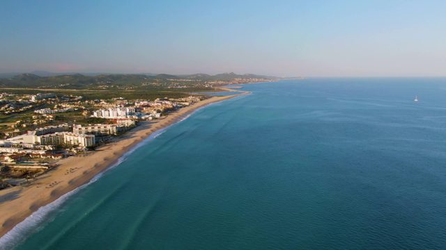 SAN JOSE DEL CABO BCS MEXICO-2022: Gentle Ocean Waves Lapping at Sandy Beach Coastline