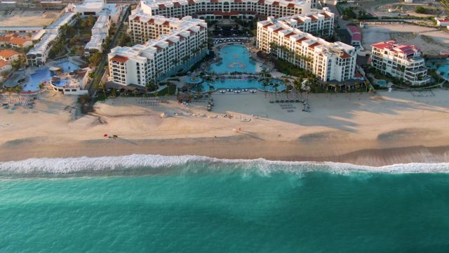 SAN JOSE DEL CABO BCS MEXICO-2022: Beach Resort Aerial Pan with Ocean and Pools