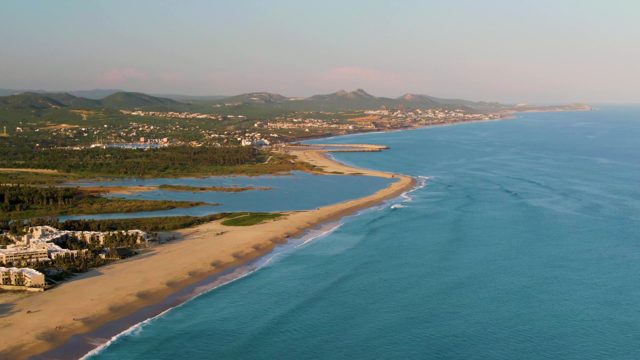 SAN JOSE DEL CABO BCS MEXICO-2022: Gentle Ocean Waves Rolling Onto Sandy Shore