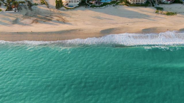 SAN JOSE DEL CABO BCS MEXICO-2022: Waves Ebbing and Flowing on a Sandy Beach