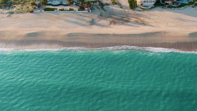 SAN JOSE DEL CABO BCS MEXICO-2022: Gentle Waves Rolling Onto Sandy Beach