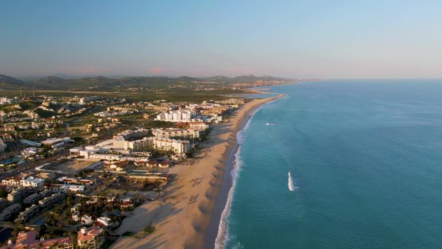 SAN JOSE DEL CABO BCS MEXICO-2022: Sandy Beach and Coastal Town with Moving Ocean Waves