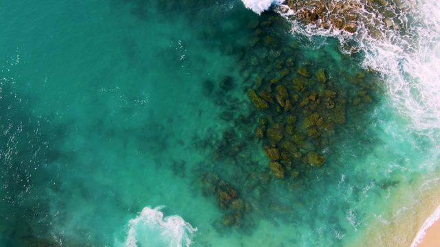 BUZZARDS EAST CAPE LOS CABOS BCS MEXICO-2022: Waves Crashing Against Rocky Shore From Above