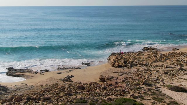 BUZZARDS EAST CAPE LOS CABOS BCS MEXICO-2022: Aerial Descent Over Rocky Beach and Ocean Waves