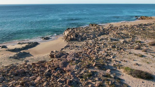 BUZZARDS EAST CAPE LOS CABOS BCS MEXICO-2022: Gentle Ocean Waves on Rocky Shore