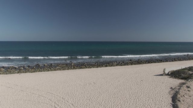 COSTA AZUL LOS CABOS BCS MEXICO-2022: Waves Rolling Onto Sandy Beach
