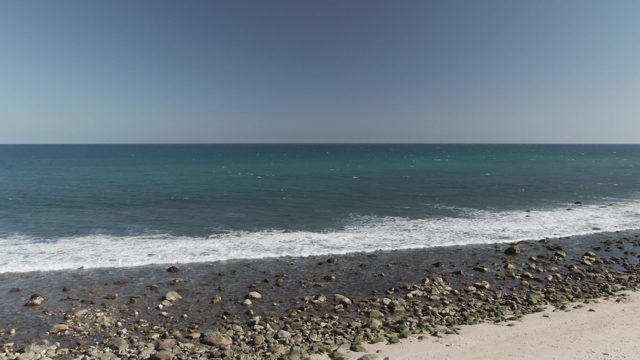 COSTA AZUL LOS CABOS BCS MEXICO-2022: Waves Rolling Onto Sandy and Rocky Shore