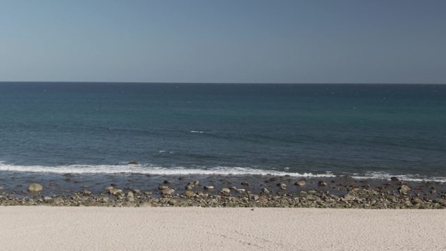 COSTA AZUL LOS CABOS BCS MEXICO-2022: Ocean Waves Rolling Toward Rocky Beach