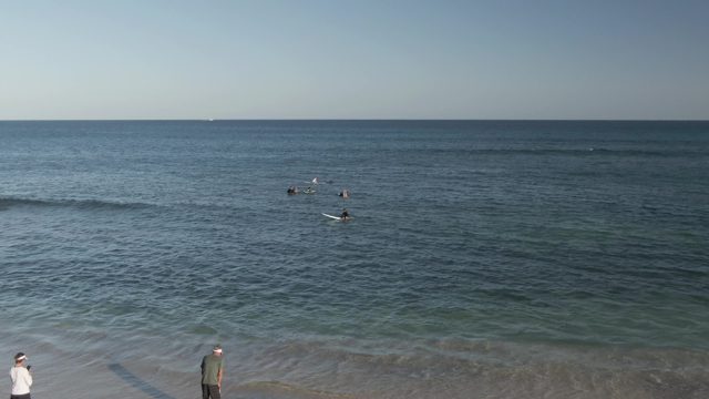 COSTA AZUL LOS CABOS BCS MEXICO-2022: Beachgoers Walking and Swimmers in the Ocean