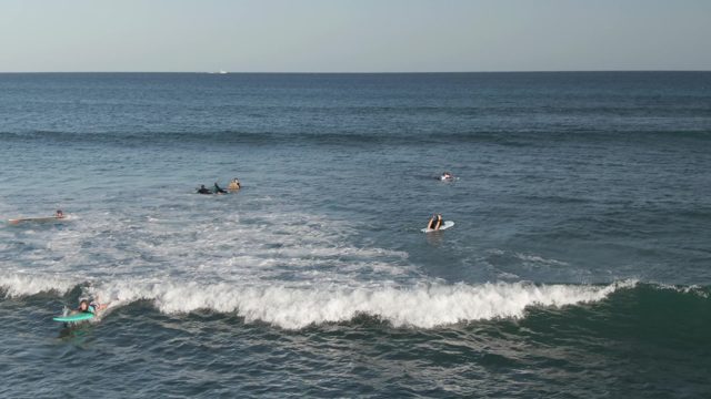 COSTA AZUL LOS CABOS BCS MEXICO-2022: Surfers Riding a Breaking Wave in the Ocean