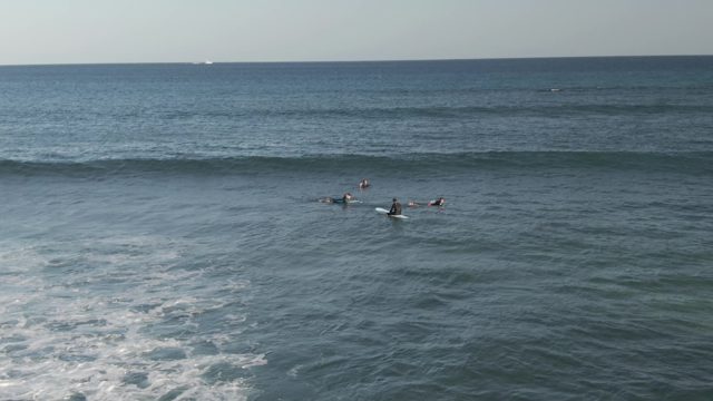COSTA AZUL LOS CABOS BCS MEXICO-2022: Surfers Paddling in the Ocean for Waves