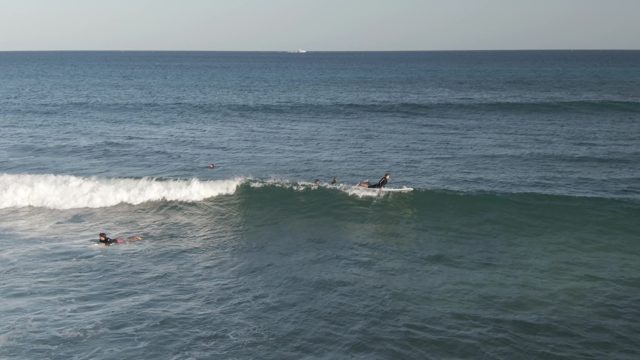 COSTA AZUL LOS CABOS BCS MEXICO-2022: Surfers Paddling and Catching Waves in the Ocean