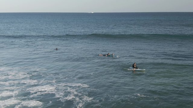 COSTA AZUL LOS CABOS BCS MEXICO-2022: Surfers Paddling in Ocean Waves