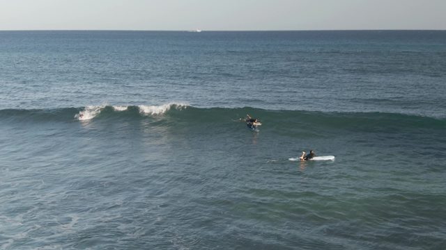COSTA AZUL LOS CABOS BCS MEXICO-2022: Surfers Paddling and Waiting for Ocean Waves