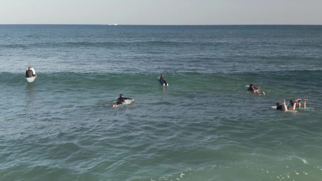 COSTA AZUL LOS CABOS BCS MEXICO-2022: Surfers Paddling in Ocean Waves