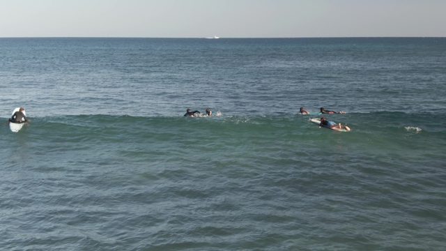 COSTA AZUL LOS CABOS BCS MEXICO-2022: Surfers Paddling and Waiting for Waves in the Ocean