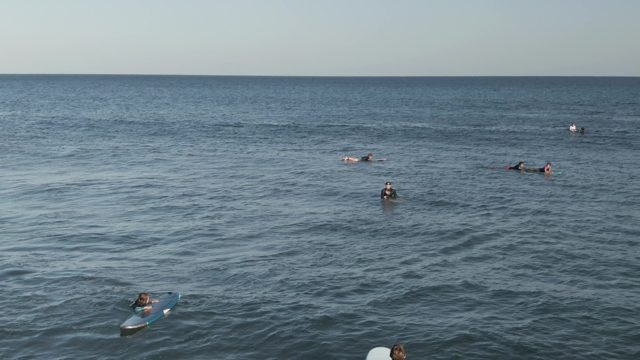 COSTA AZUL LOS CABOS BCS MEXICO-2022: Surfers Paddling and Waiting for Waves in the Ocean