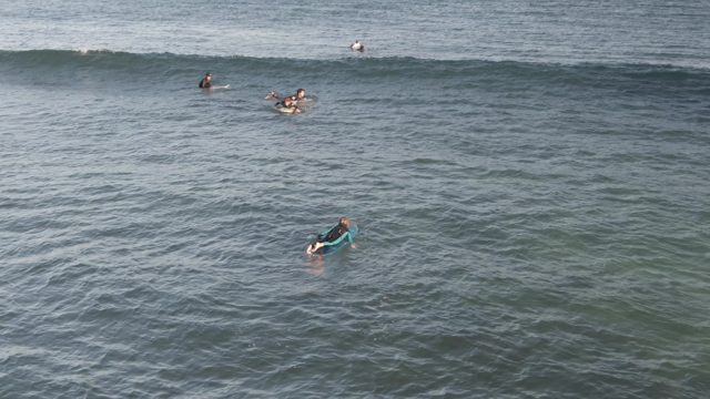 COSTA AZUL LOS CABOS BCS MEXICO-2022: Surfers Paddling on Surfboards in the Ocean
