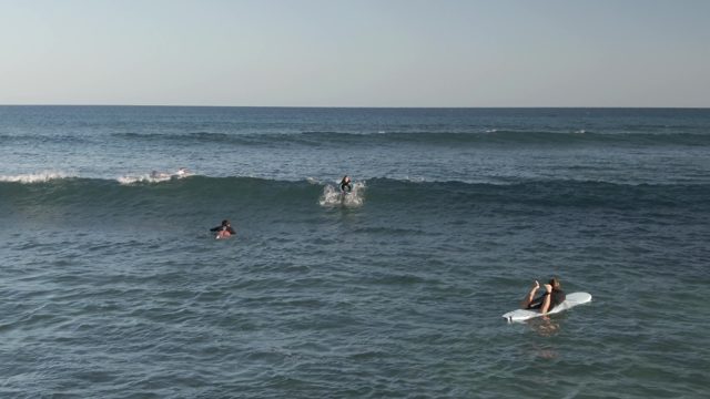 COSTA AZUL LOS CABOS BCS MEXICO-2022: Surfers Paddling and Riding Ocean Waves
