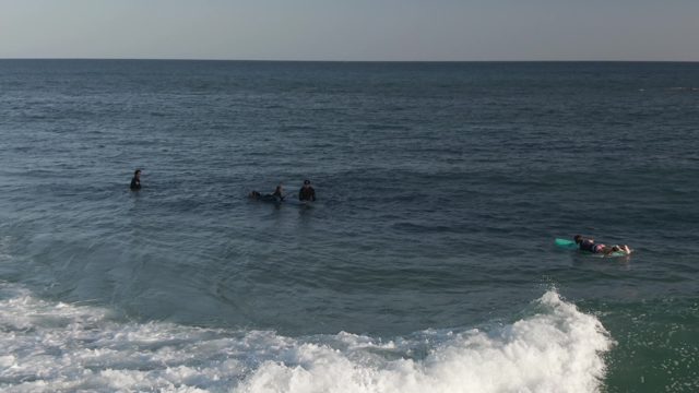 COSTA AZUL LOS CABOS BCS MEXICO-2022: Surfers and Bodyboarders Navigating a Breaking Wave