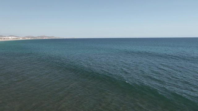 BUZZARDS EAST CAPE LOS CABOS BCS MEXICO-2022: Waves Receding From Sandy Shoreline