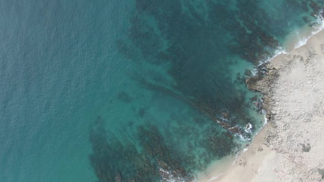 BUZZARDS EAST CAPE LOS CABOS BCS MEXICO-2022: Gentle Waves on Rocky and Sandy Coastline