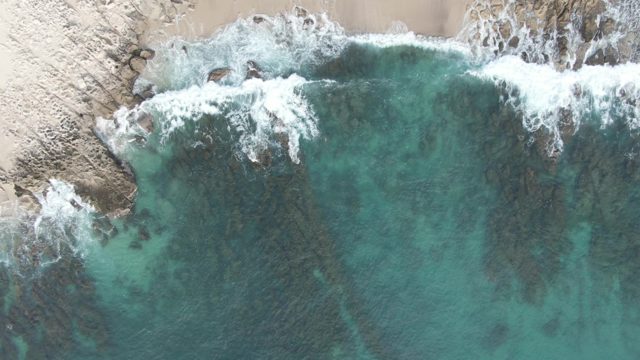 BUZZARDS EAST CAPE LOS CABOS BCS MEXICO-2022: Waves Crashing on Rocky Shore From Above