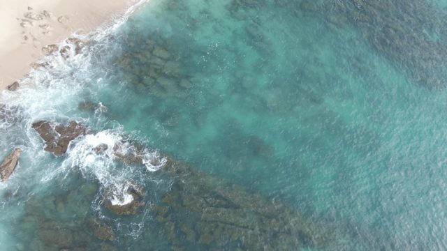 BUZZARDS EAST CAPE LOS CABOS BCS MEXICO-2022: Sandy Beach and Turquoise Ocean with Rocky Shoreline