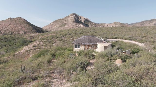 CABO PULMO BCS MEXICO-2022: Desert House with Person Exiting Porch
