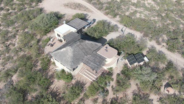 CABO PULMO BCS MEXICO-2022: Person Maintaining Roof on Desert Home