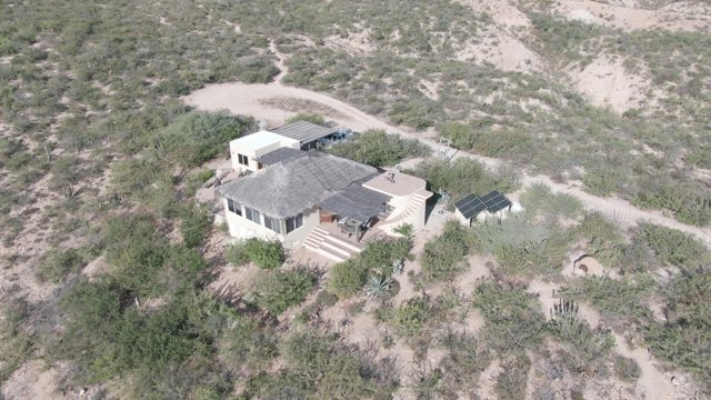 CABO PULMO BCS MEXICO-2022: Person Moving on Desert House Roof
