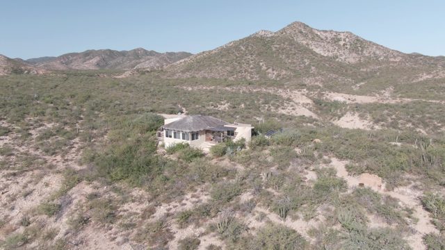 CABO PULMO BCS MEXICO-2022: House in Desert Landscape with Mountain Backdrop