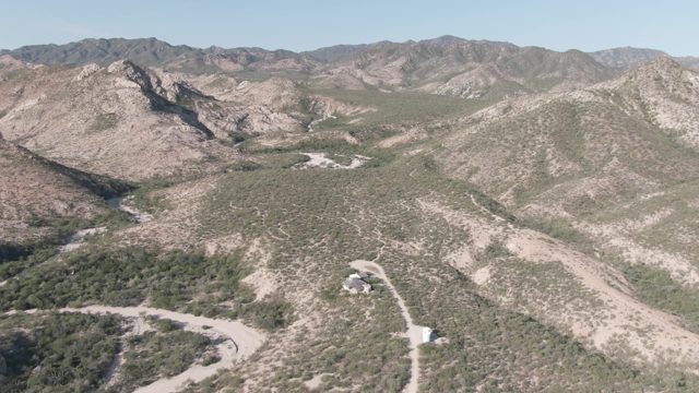 CABO PULMO BCS MEXICO-2022: Car Moving Along Arid Mountain Trail