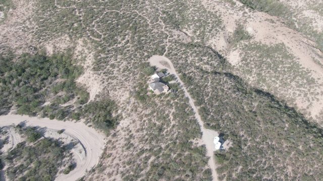 CABO PULMO BCS MEXICO-2022: Arid Hillside with Winding Dirt Roads and Small Structures
